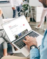 cropped-shot-of-young-businessman-using-laptop-with-airbnb-website-on-screen.jpg